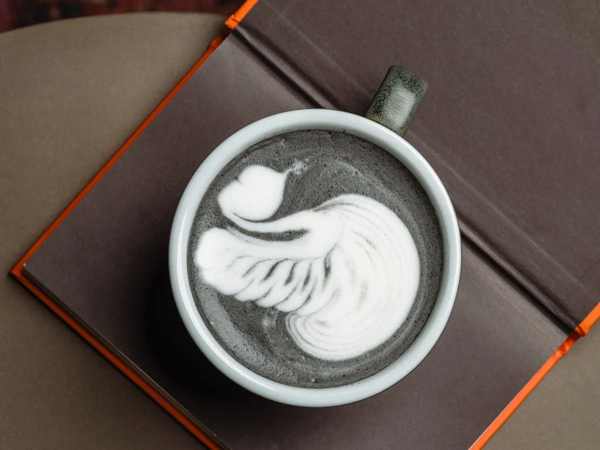 Charcoal latte with latte art